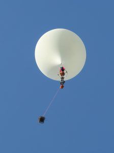 Weather balloon with payload string in flight
